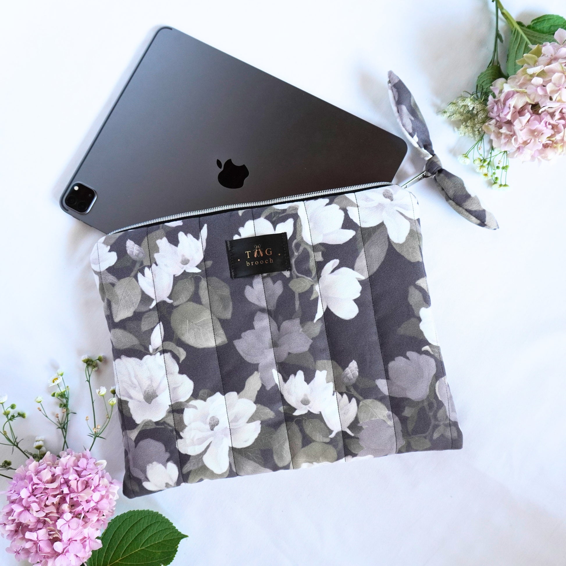 Floral-patterned Ipad pouch with magnolia bloom pattern designed by TGbrooch