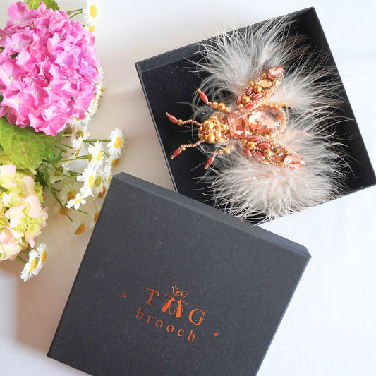 Handmade embroidered beaded insect brooch in peach and gold color combination and feathers - TGbrooch